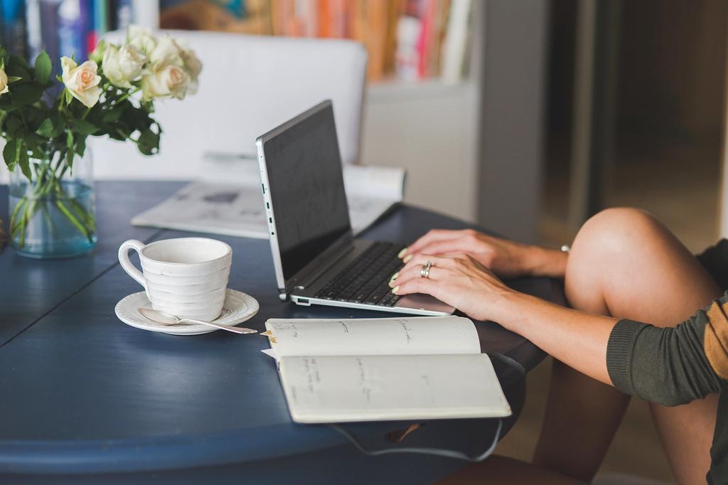 Modern workspace with laptop and books representing learning and growth